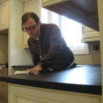 Richlite counter installation Counter installer is finishing the last details for our new kitchen