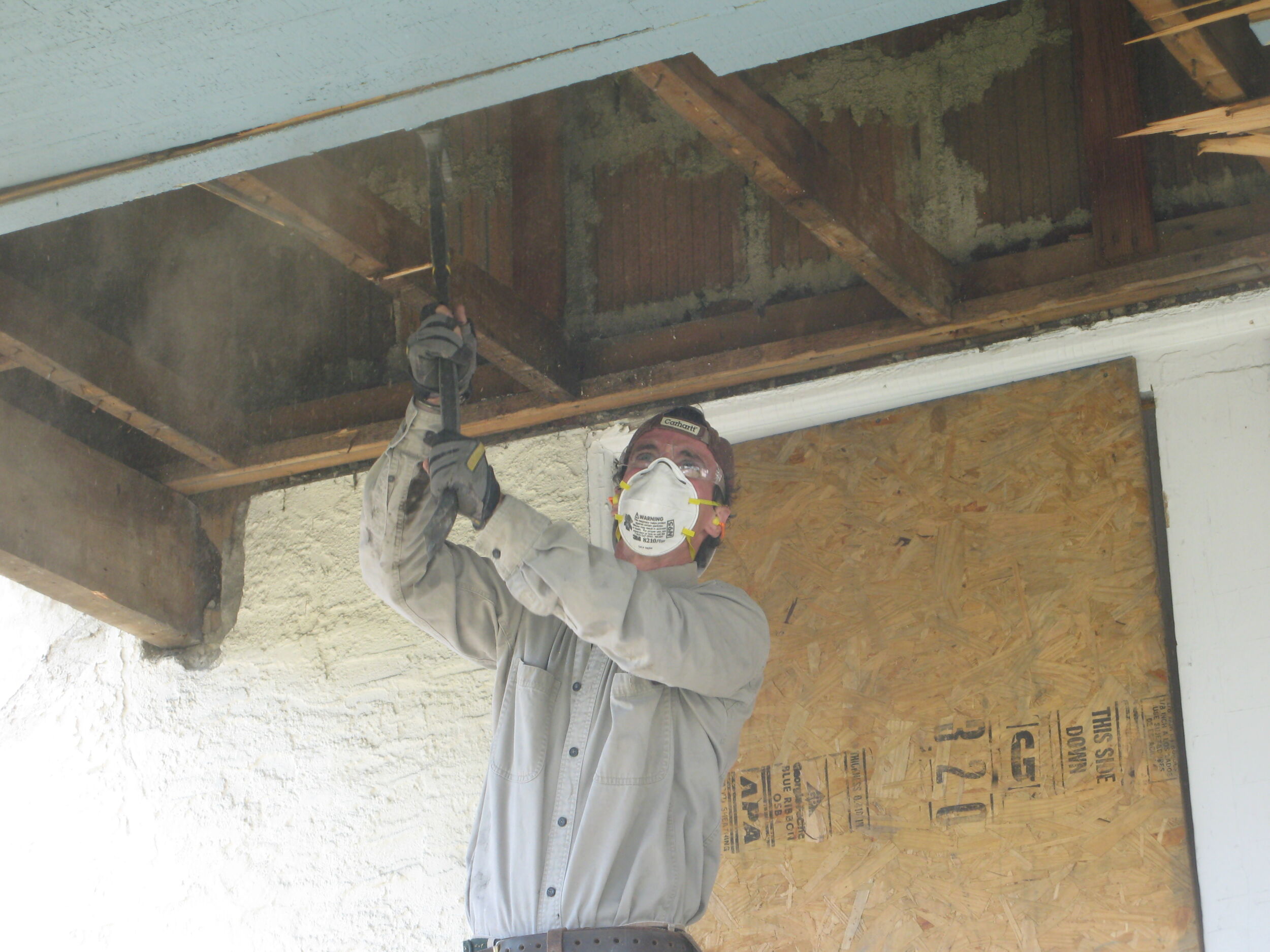 Mark demoing the ceiling of the front porch