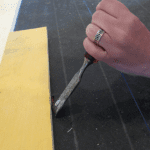 Snug up the seems between boards with the old chisel-as-pry-bar trick