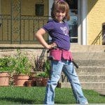 Lexi posing in her pink toolbelt
