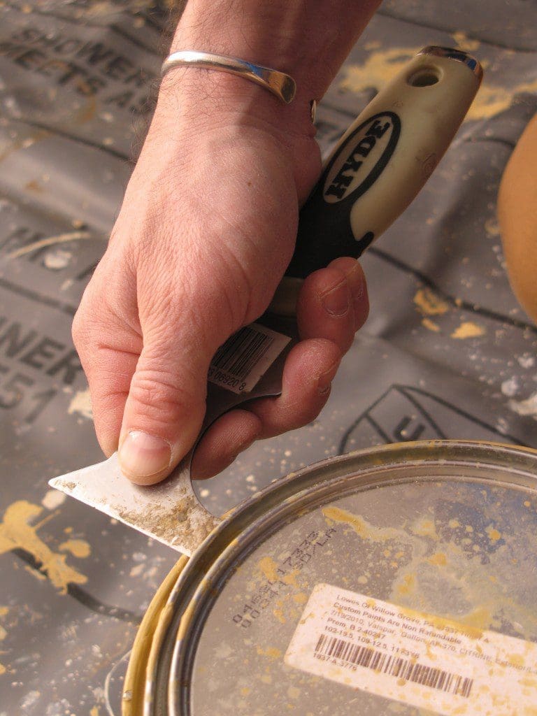 Mark opening a paint can Hyde tool