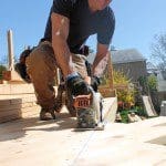 Mark trimming cedar deck boards