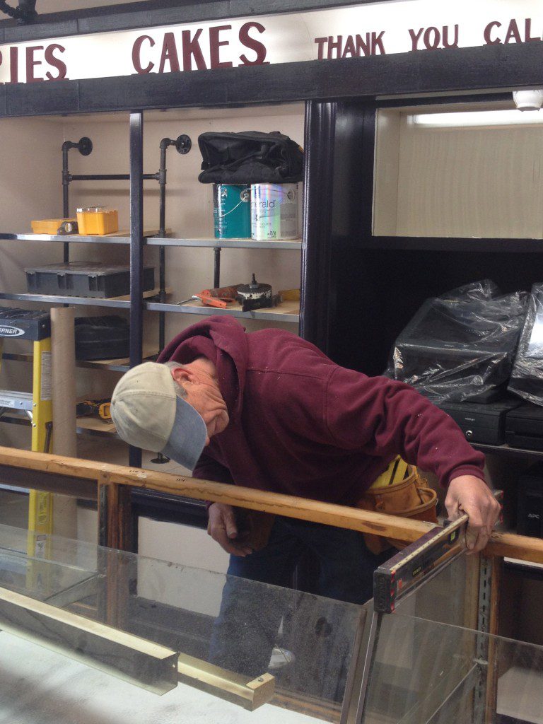 Carpenter Tom Johnstone works on the new Formica Sequoia Soapstone counter 