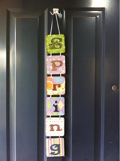 spring door hanger made of coasters, scrapbook paper, chipboard letters, and ribbon FrugalGirls