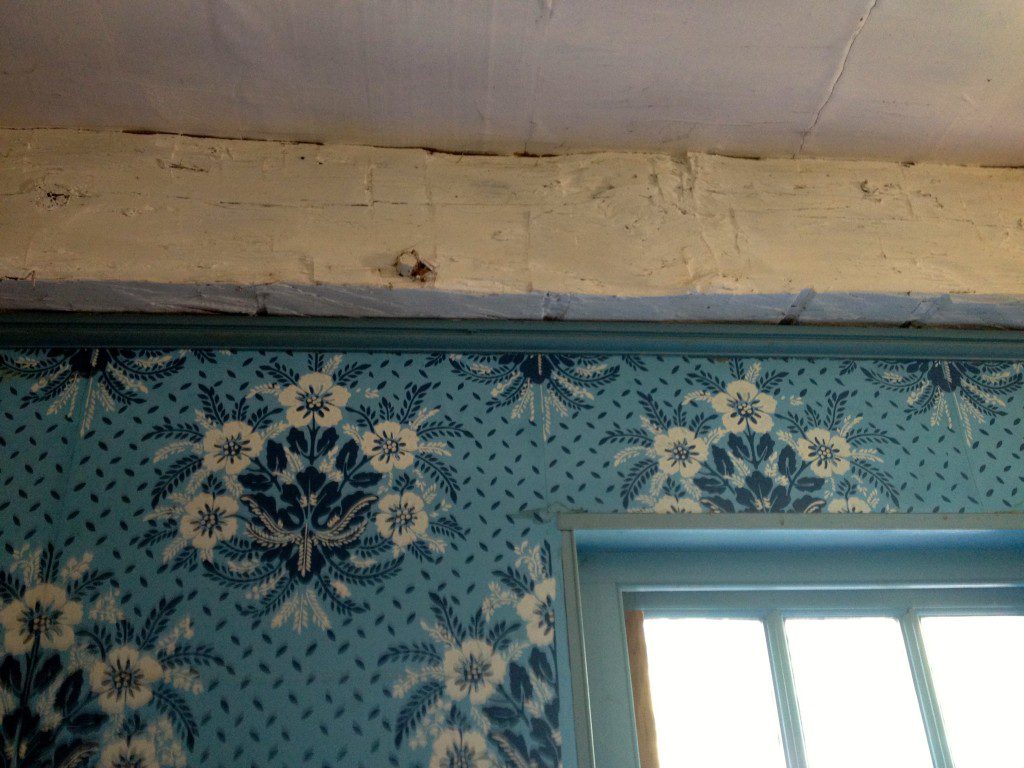 Ceilings made from newspaper, and top of the walls 'unfinished' but there's decorative wallpaper at the little house at Old Sturbridge Village.