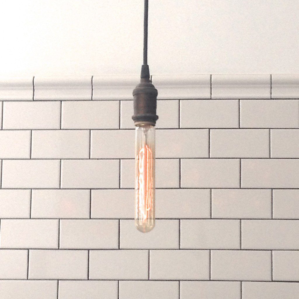     Two trends in one look: Edison bulb with white subway tile MyFixitUpLife