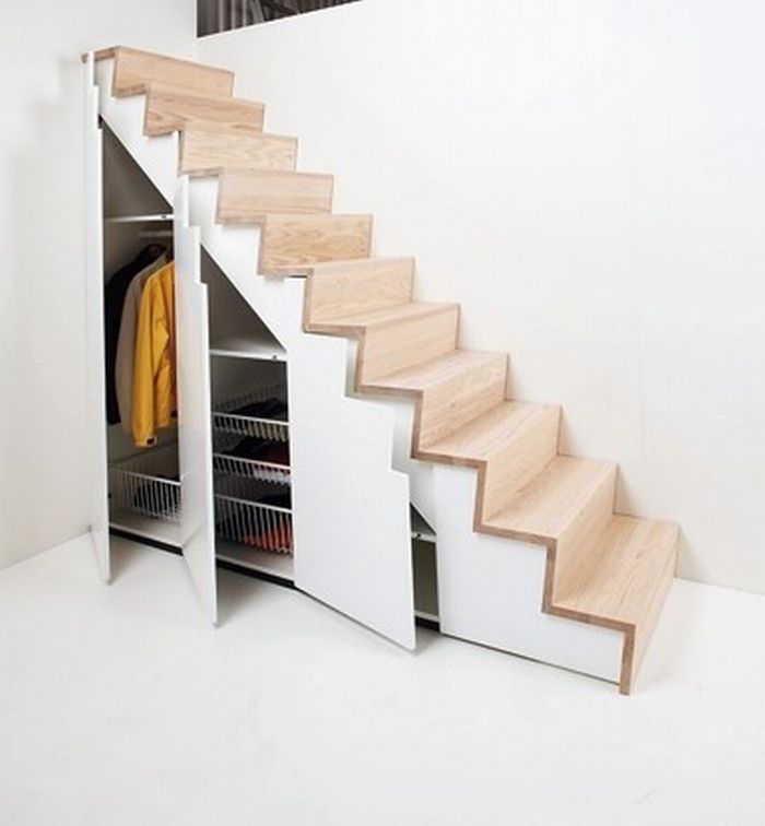Under the stairs becomes a perfect opportunity for storage in a small space