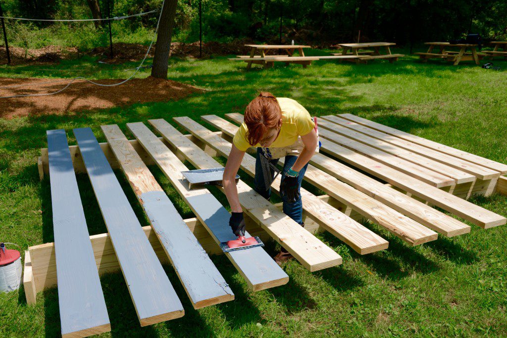 Before we put the wall slats in place, we primed the boards. Theresa discovered that this deck staining pad makes the process of staining really fast and easy. Shur-Line