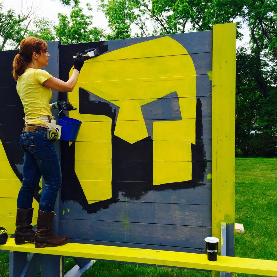 Theresa is recreating the Spartan Race logo on a training wall for the Hatboro YMCA.