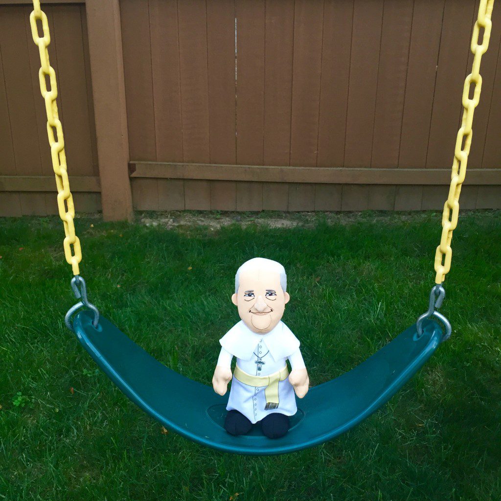 It was a gorgeous afternoon, and Plush Pope decided to take a break and swing on our playset. 
