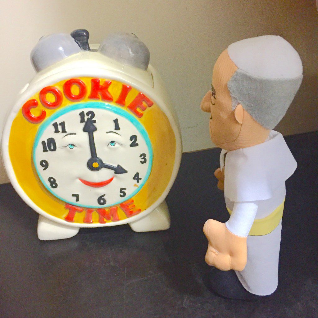 Plush Pope Francis, just like Pope Francis, like sweets. He was wondering what time is Cookie Time? Looks like 4 o'clock. 