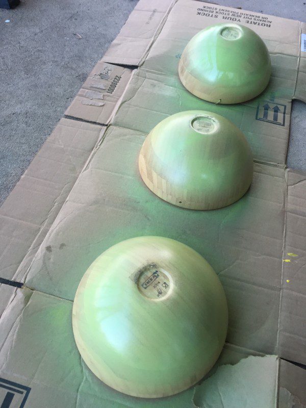 I dusted a few coats of green spray paint on the wood bowls for the witch's faces.