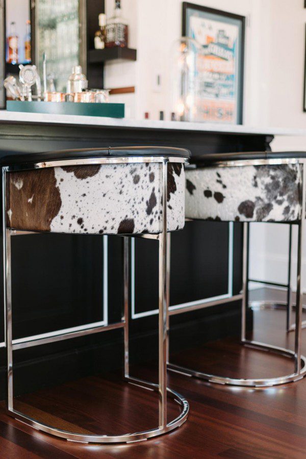 This Arteriors Calvin barrel-style tufted barstool is covered in top grain black and white hide leather. I spotted the cowhide masculine bar stools on HGTV.com.
