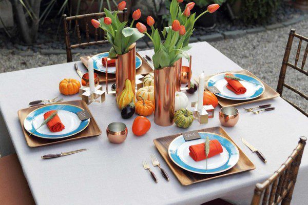 Entertainologist Lulu Powers has a solution for every party and for everyday. The candlesticks and copper pitchers filled with tulips are a quick way to upgrade any table.