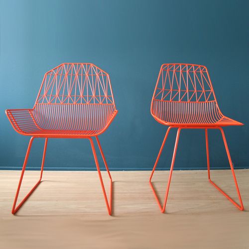 These chairs against the background are a perfect vision of complementary colors.