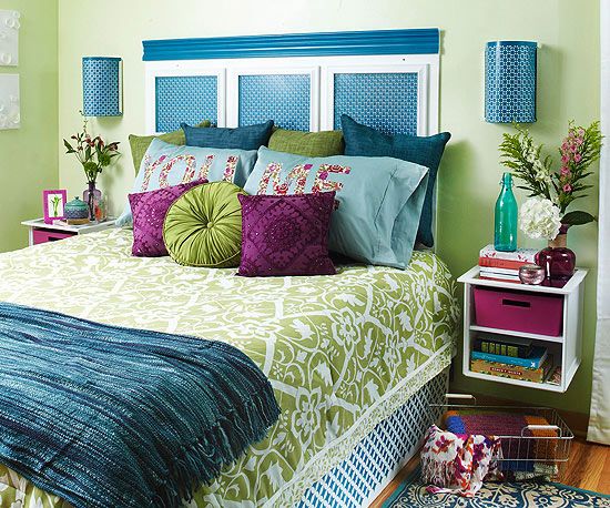 A vibrant look, this bedroom shares the analogous color scheme of purple, blues and greens.