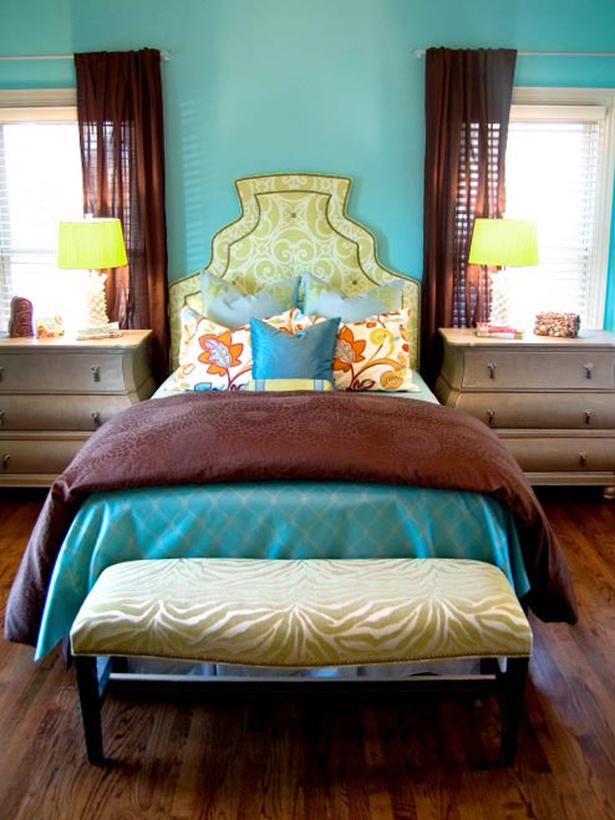 This bedroom is a color triad of yellow, red-orange (brown), and blue-green. Neither too masculine nor feminine, but tons of personality and a bit luxe.
