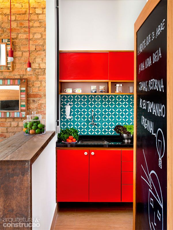 Turquoise and red have the orangey brick and blackboard frame in this view, making it a split complementary color scheme.