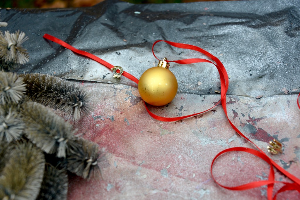 I tied a few gold and silver balls with ribbon and attached them to the wreath. 