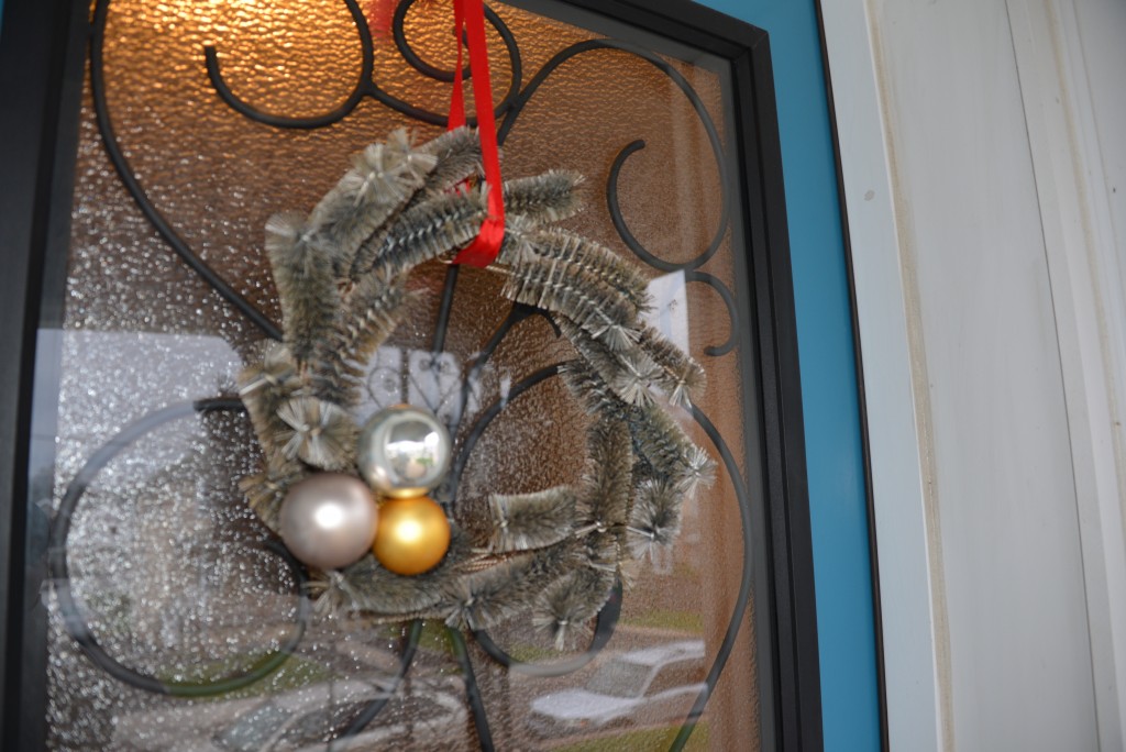 The wreath looks very festive on our door. 