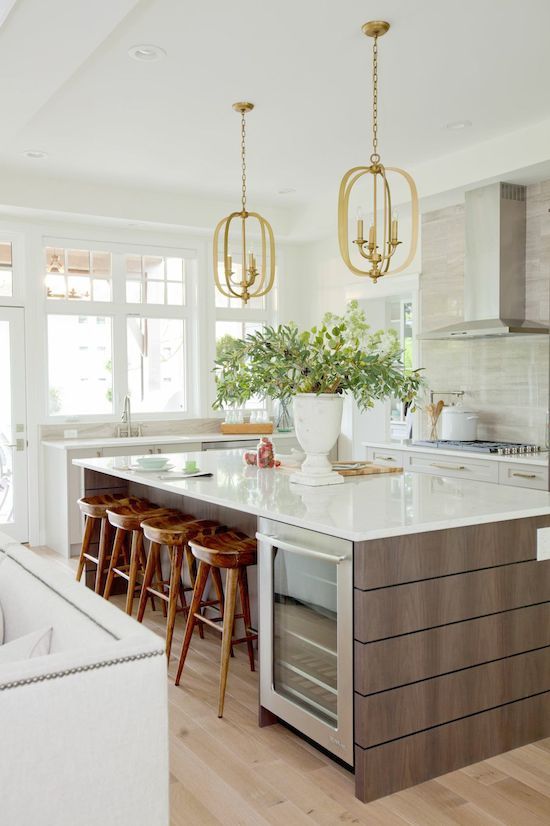 Yes, you can use a different metal on your lighting than your faucet and cabinet hardware. These lights are stunners in an otherwise low-key kitchen. spotted from Jillian Harris