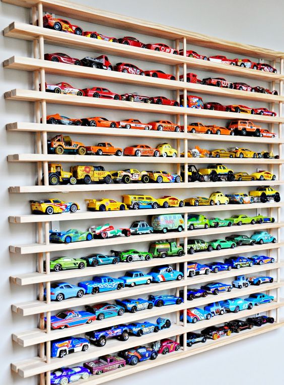 Diecast cars can be tough to store and sort, but not when you organize them as a wall art. 