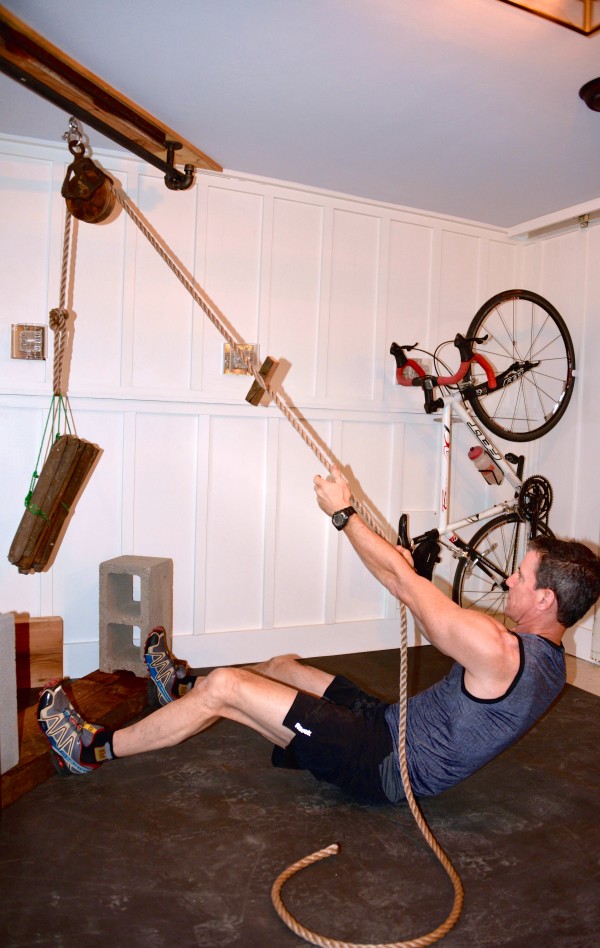 My husband Mark used an old pulley to create a unique exercise station in our basement man cave. 