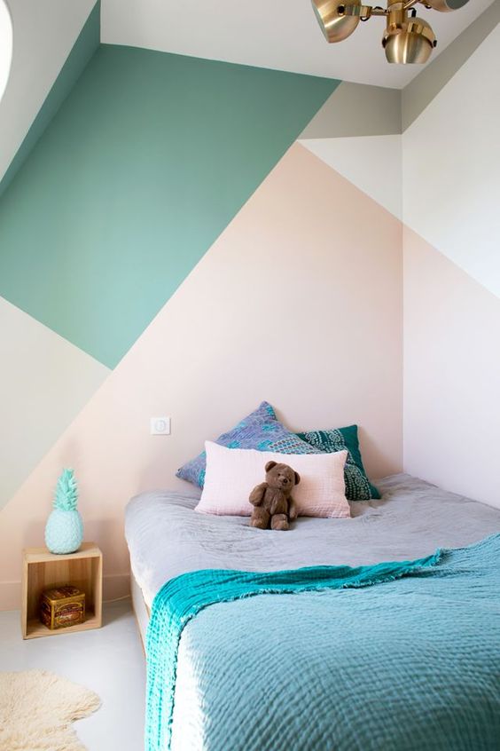 A few oversized shapes on a bedroom wall create a cozier space. 