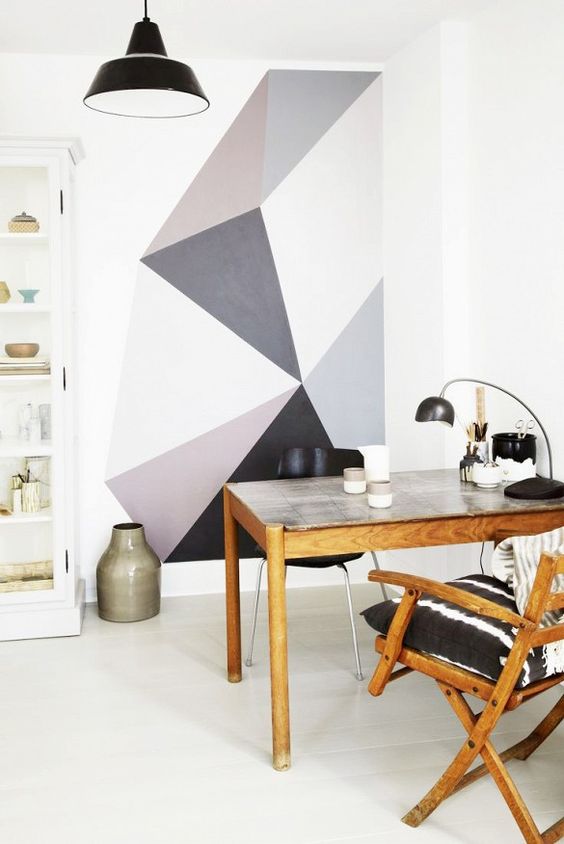  Gray geometric painted shapes are a calm and fun backdrop to this workspace