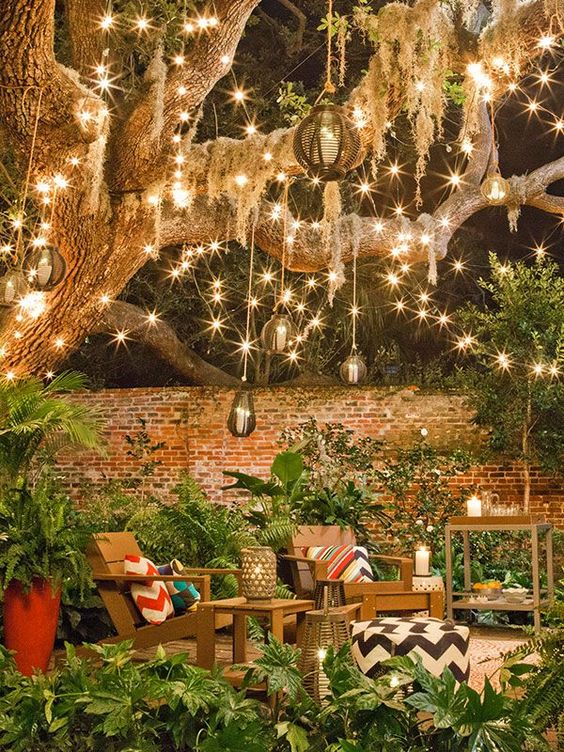 String lights and some festive decor make this backyard into a retreat