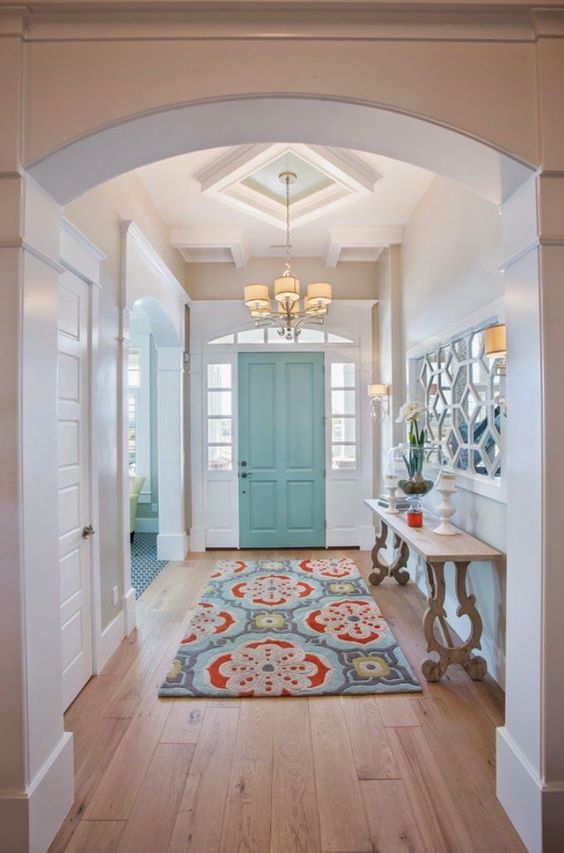 A blue-green entry door might make your guests feel calm when they come visit.