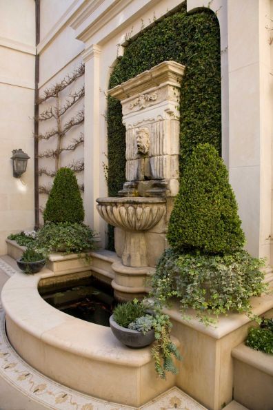 Not everyone has the budget or the space for this fountain, but keep in mind design elements that are traditional and familiar when implementing a backyard design plan.