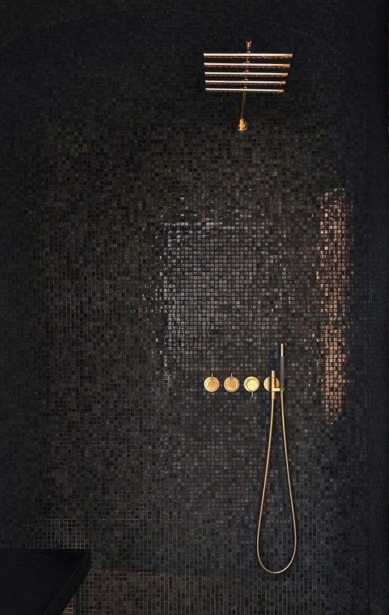 Glamour shower is a nighttime affair in here. I'm inspired for a black & tan. VOLA Taps and Showers for Bathroom in Brass Apartment by Jordens Arkitekter