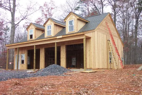 Back prime and seal end-cuts in cedar siding before final installation.