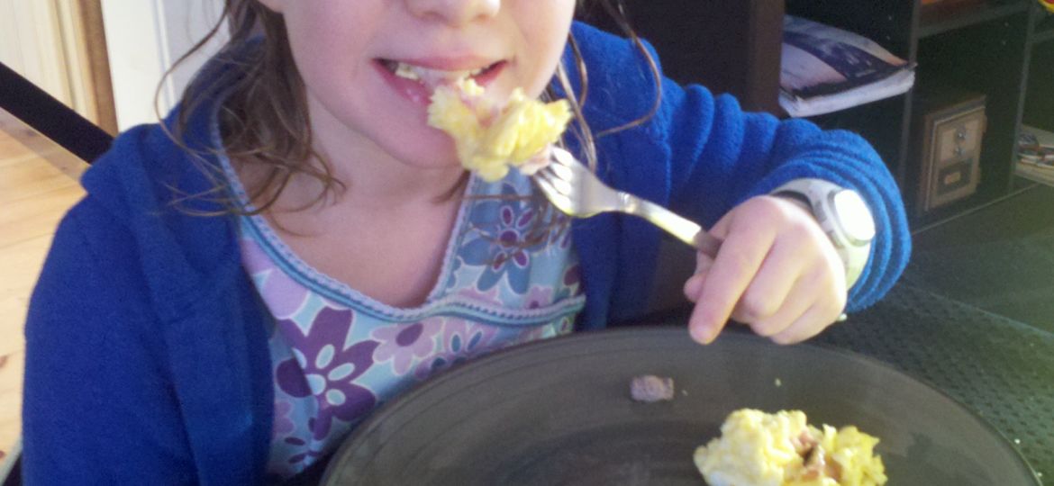 Lexi eating eggs