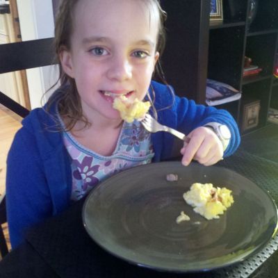 Lexi eating eggs