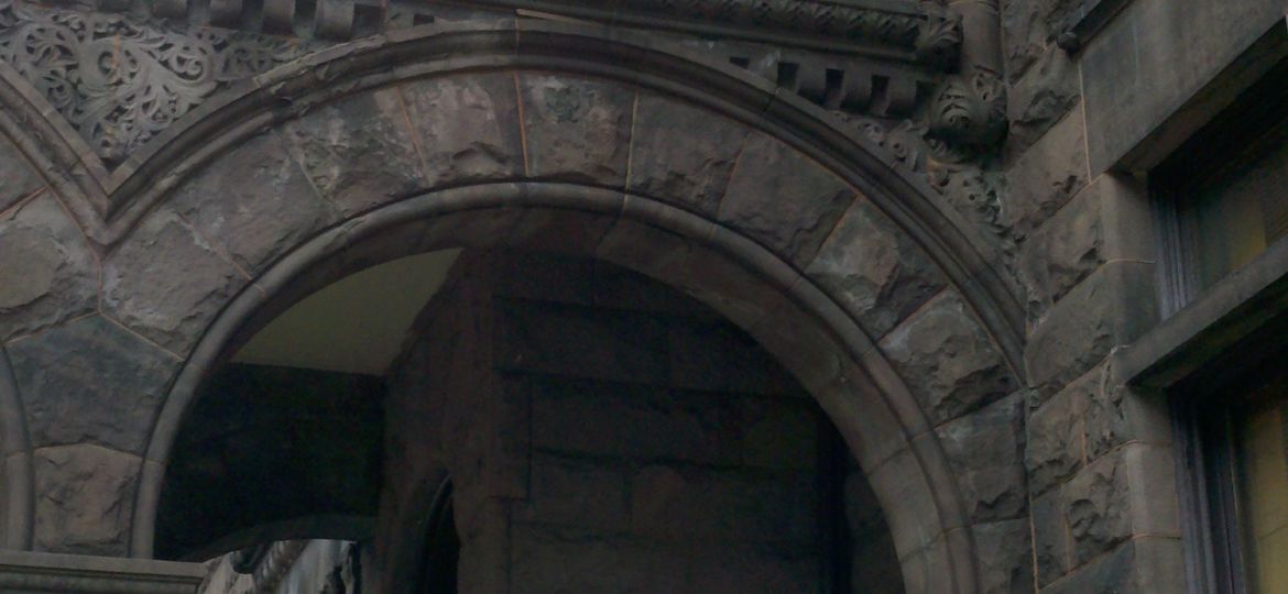 A segmented arch in a Victorian era Richardsonian Romanesque mansion.