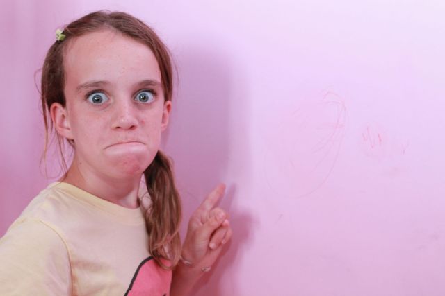 Lexi is unhappy about crayon on her wall