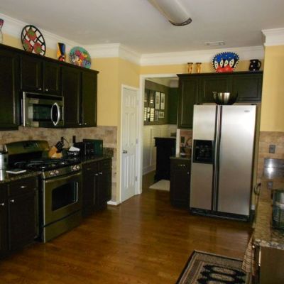 Painting cabinets---using the right tools, techniques and products---can be an affordable and effective kitchen upgrade.