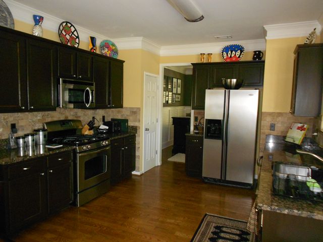 Painting cabinets---using the right tools, techniques and products---can be an affordable and effective kitchen upgrade.