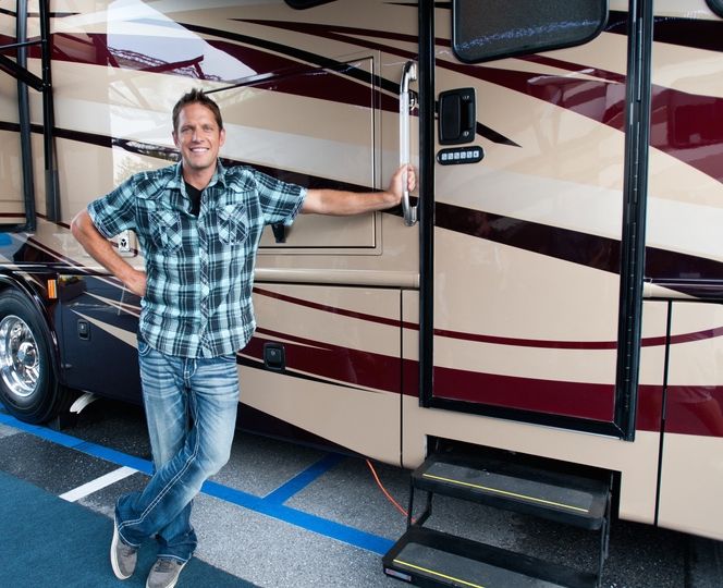 Host Chris Lambton, poses for a shot outside the Forest River Dynamex DX3.  RV living