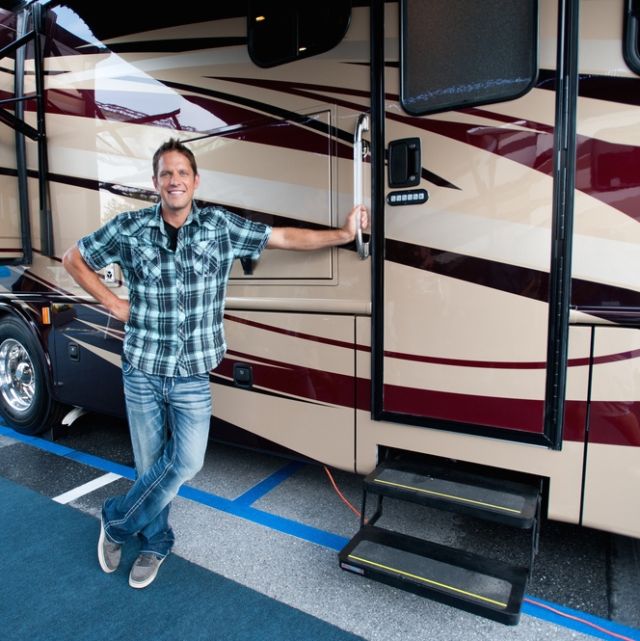 Host Chris Lambton, poses for a shot outside the Forest River Dynamex DX3.  RV living
