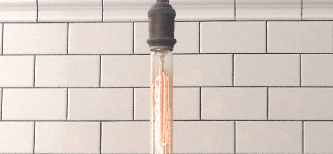 Two trends in one look: Edison bulb with white subway tile MyFixitUpLife