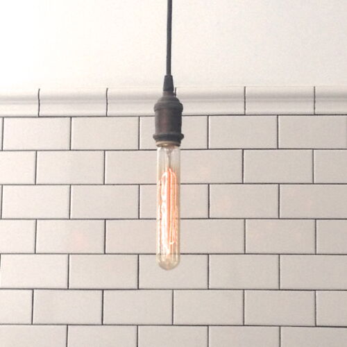 Two trends in one look: Edison bulb with white subway tile MyFixitUpLife
