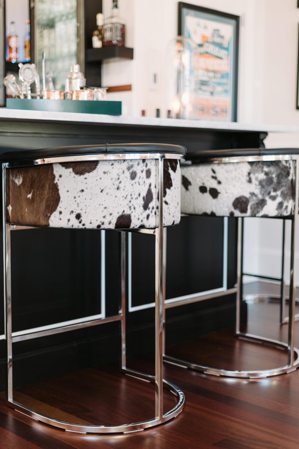 This Arteriors Calvin barrel-style tufted barstool is covered in top grain black and white hide leather. I spotted the cowhide barstool on HGTV.com.