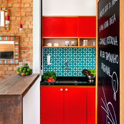 Turquoise and red have the orangey brick and blackboard frame in this view, making it a split complementary color scheme.