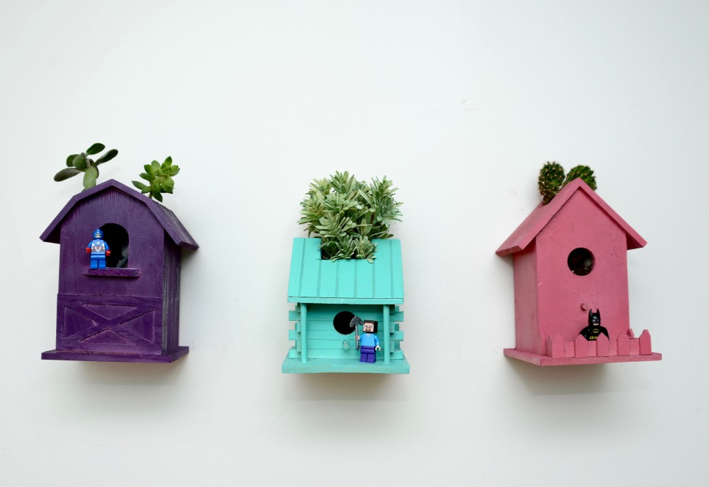 Birdhouse planters filled with succulents put us in the mood for spring.