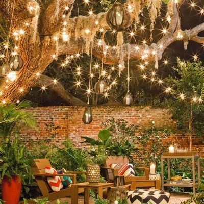String lights and some festive decor make this backyard into a retreat