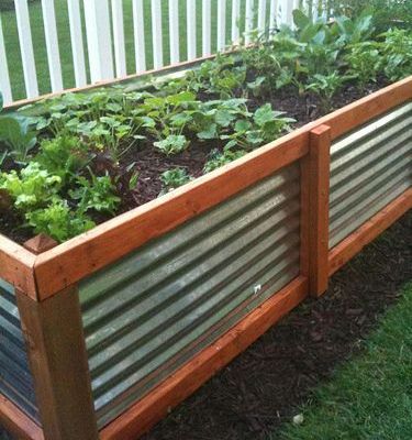 This-galvanized-steel-and-stained-wood-planter-is-visually-easy-to-see-and-helps-define-the-yard.-2