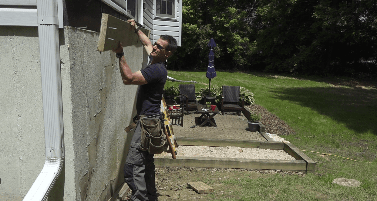 How to attach deck ledger board to house securely